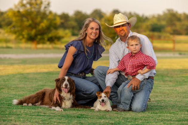 Family with their dogs on the grass