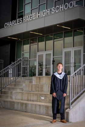 Graduate in cap and gown at Charles Page High School