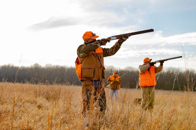 Hunters in a field during a branding session