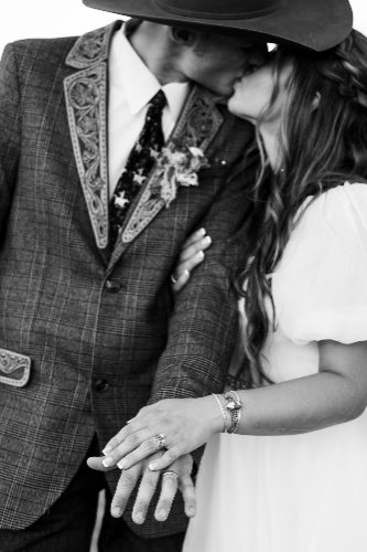 Black and white portrait of a western groom and bride