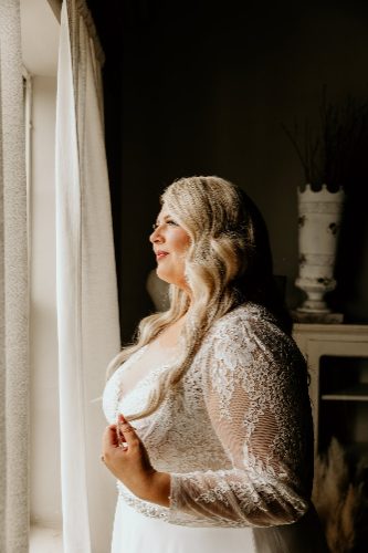 Bride by the window in soft natural light