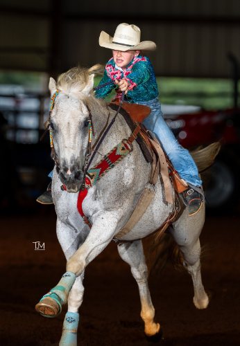 Barrel racing photo by Taylor McClain